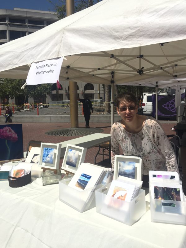 Pernilla in her art booth at civic center art bazaar